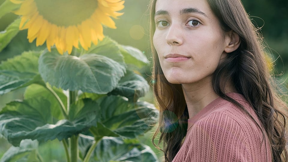 Woman in a field of sunflowers