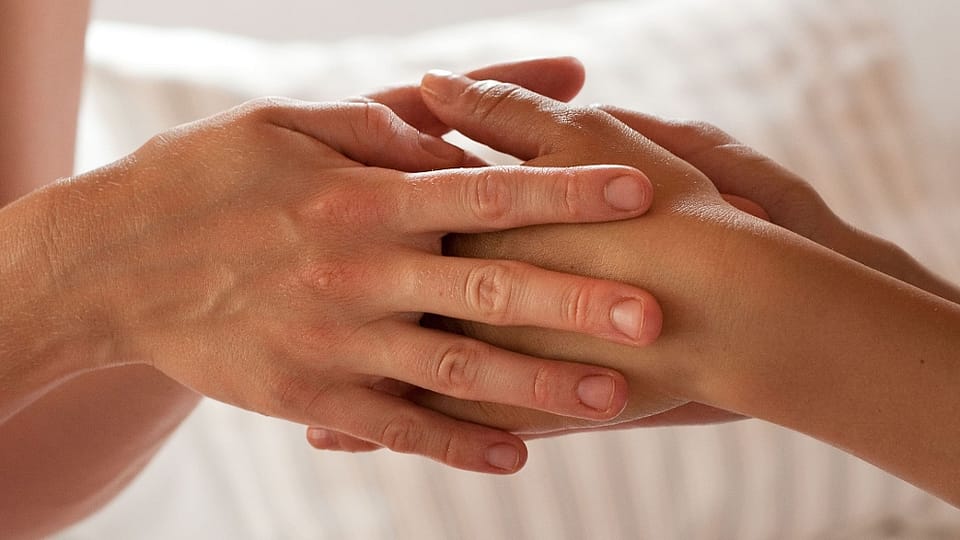 Two touching hands